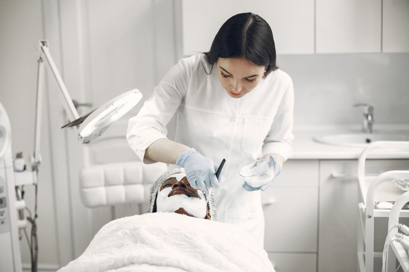 Specialist preparing a facial treatment