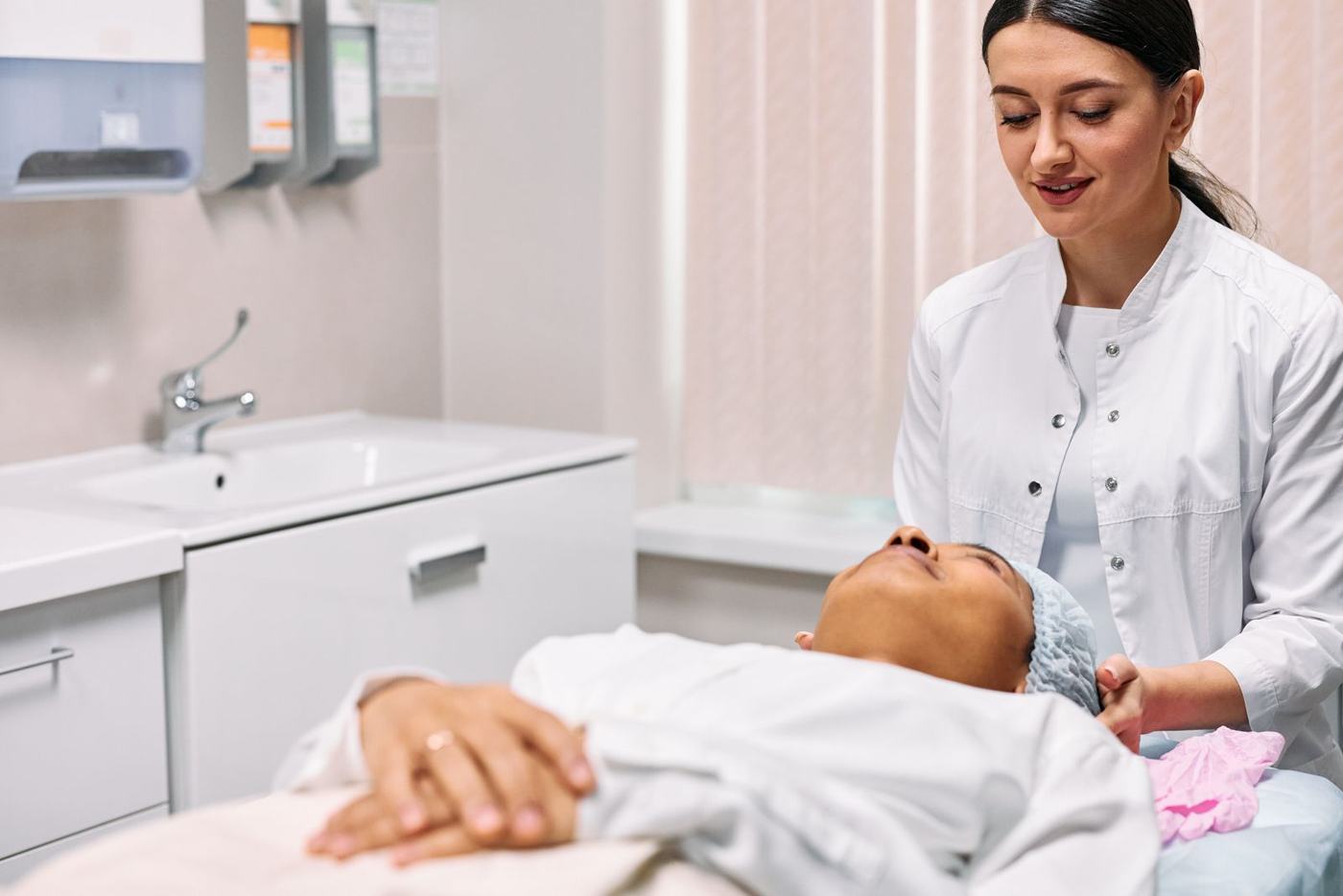 Clinician speaking with a patient in a treatment room